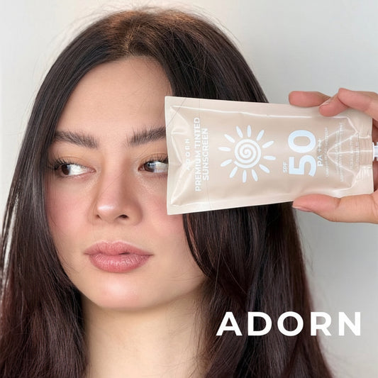 Woman with a防晒霜包遮住眼睛,品牌为'ADORN'