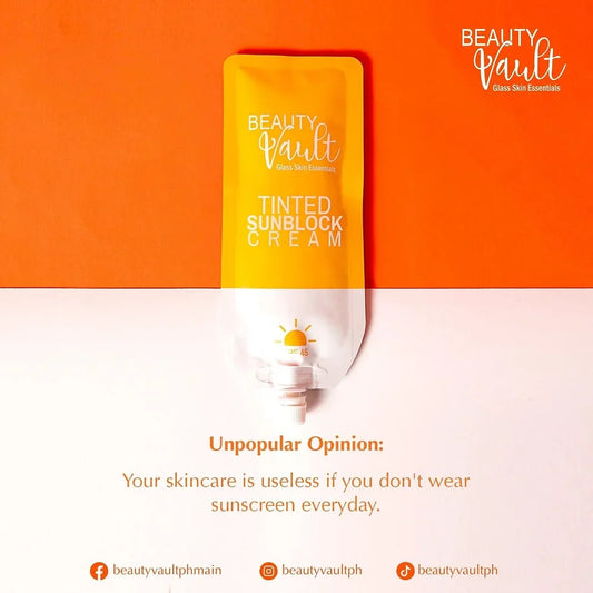 Tinted sunblock cream packaging with 'Beauty Vault' branding on an orange and white background.