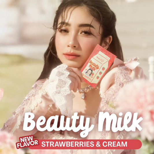 Woman holding a 'Beauty Milk' product with strawberries & cream flavor text overlay