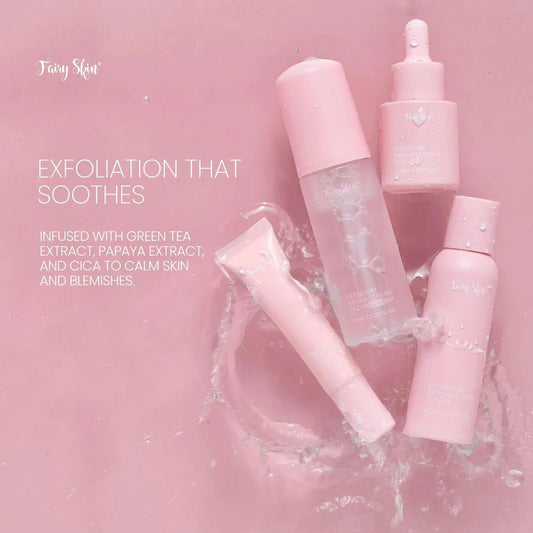 Pink skincare products on a pink background with text about exfoliation and ingredients.