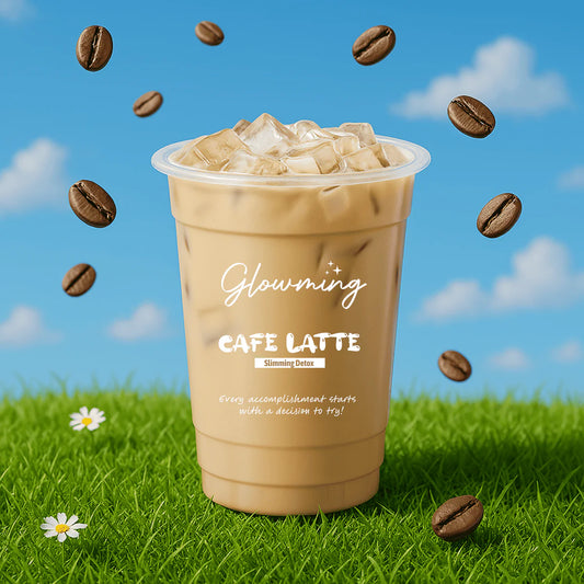 Cup of Cafe Latte with 'Glowing' branding on grass with coffee beans and a blue sky.
