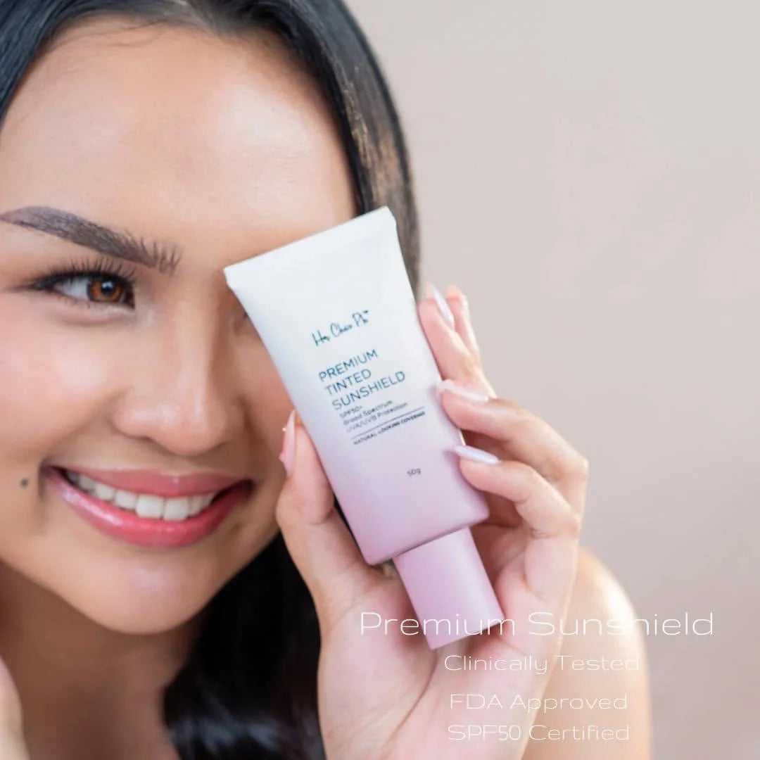 Woman holding a pink sunscreen tube with text on a neutral background
