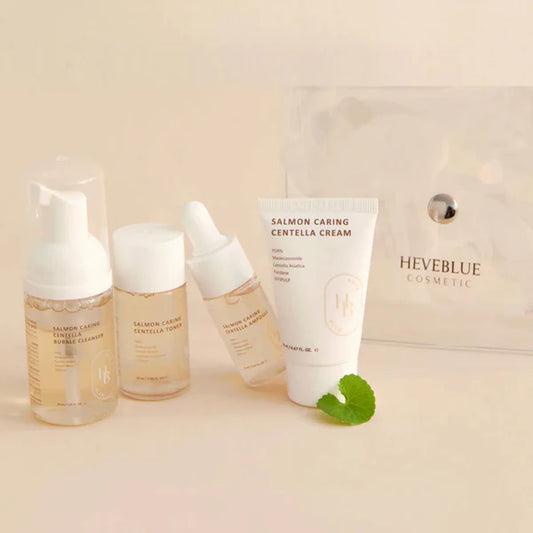 Cosmetic products including bottles and a tube with 'HEVEBLUE' branding on a beige background.