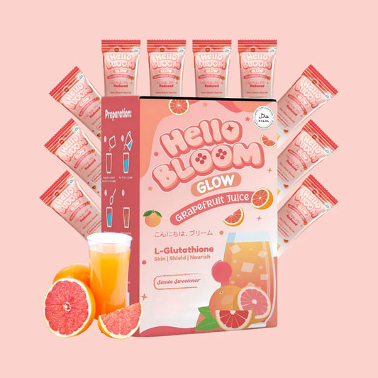 Hello Bloom Grapefruit Juice packaging with multiple packets on a pink background
