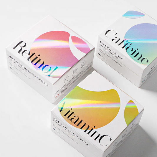 Three skincare product boxes labeled Retinol, Vitamin C, and Caffeine on a white background.