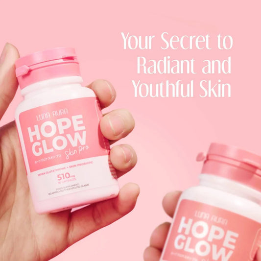 Hand holding a pink 'Hope Glow' supplement bottle with text on a pink background