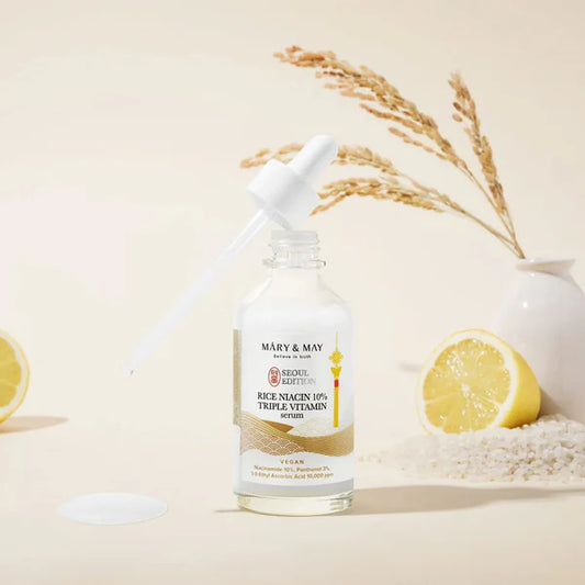 Skincare bottle with lemon and rice on a beige background