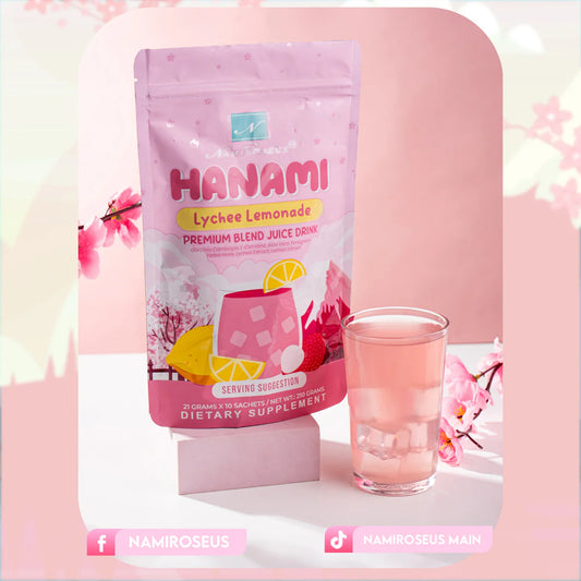 Hanami Lychee Lemonade package with a glass of pink drink on a light pink background with cherry blossoms.