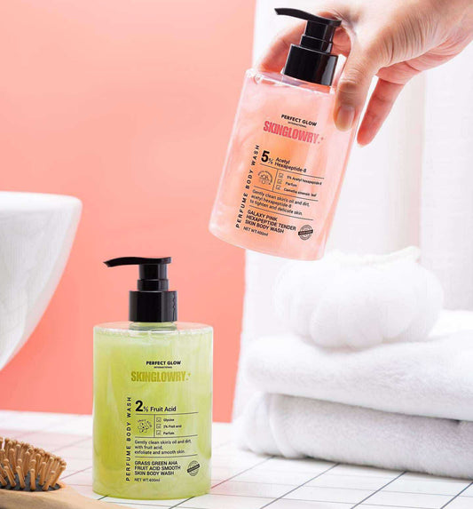 Two skincare products on a bathroom counter with a hand holding one of them.