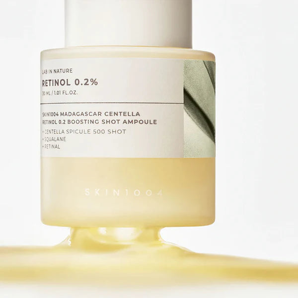 Skincare ampoule with visible branding on a light background