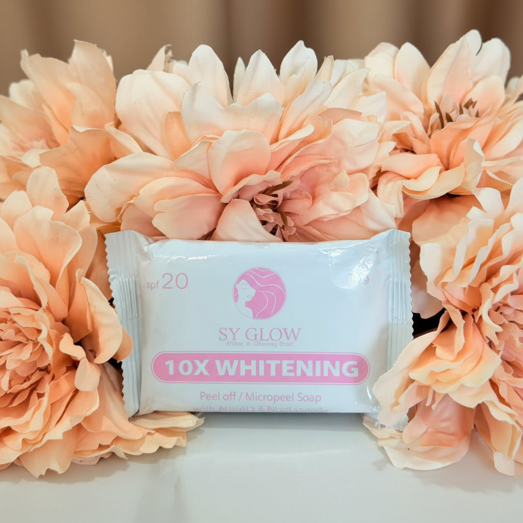 SY Glow 10X Whitening peel-off mask surrounded by peach flowers on a beige background