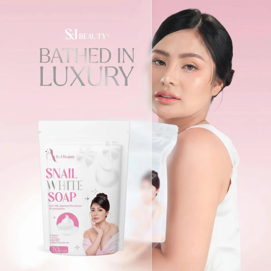 Advertisement for S.J Beauty snail white soap with a woman's face on a pink background