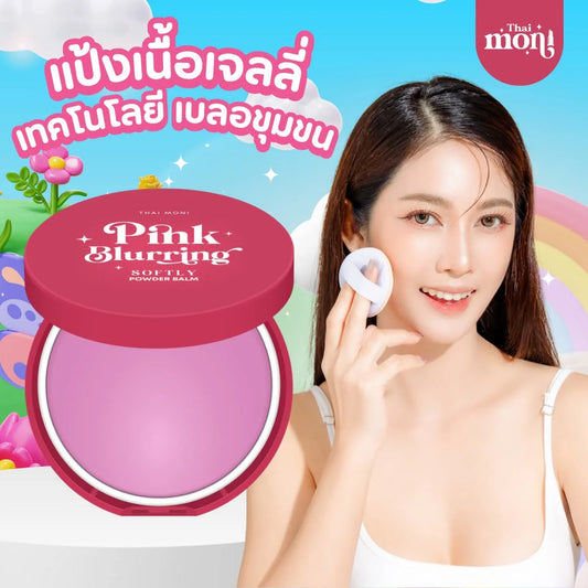 Pink Blurring powder balm with a woman applying it on her face, colorful background with Thai Moon branding.