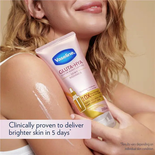 Vaseline Gluta-Hya lotion being applied to a person's arm with a beige background