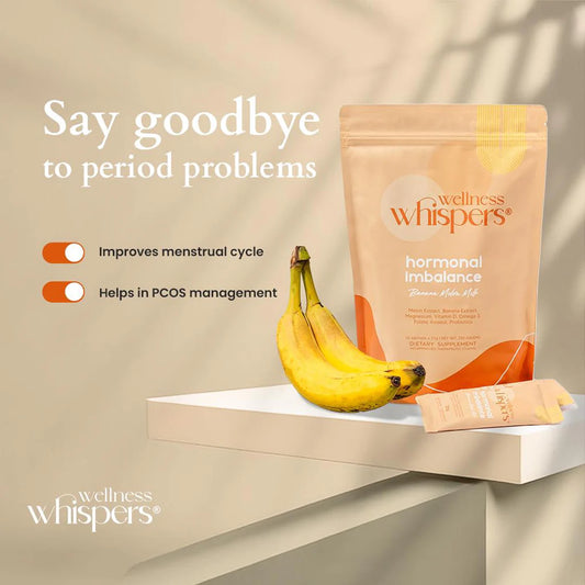 Wellness Whispers product packaging with bananas on a neutral background