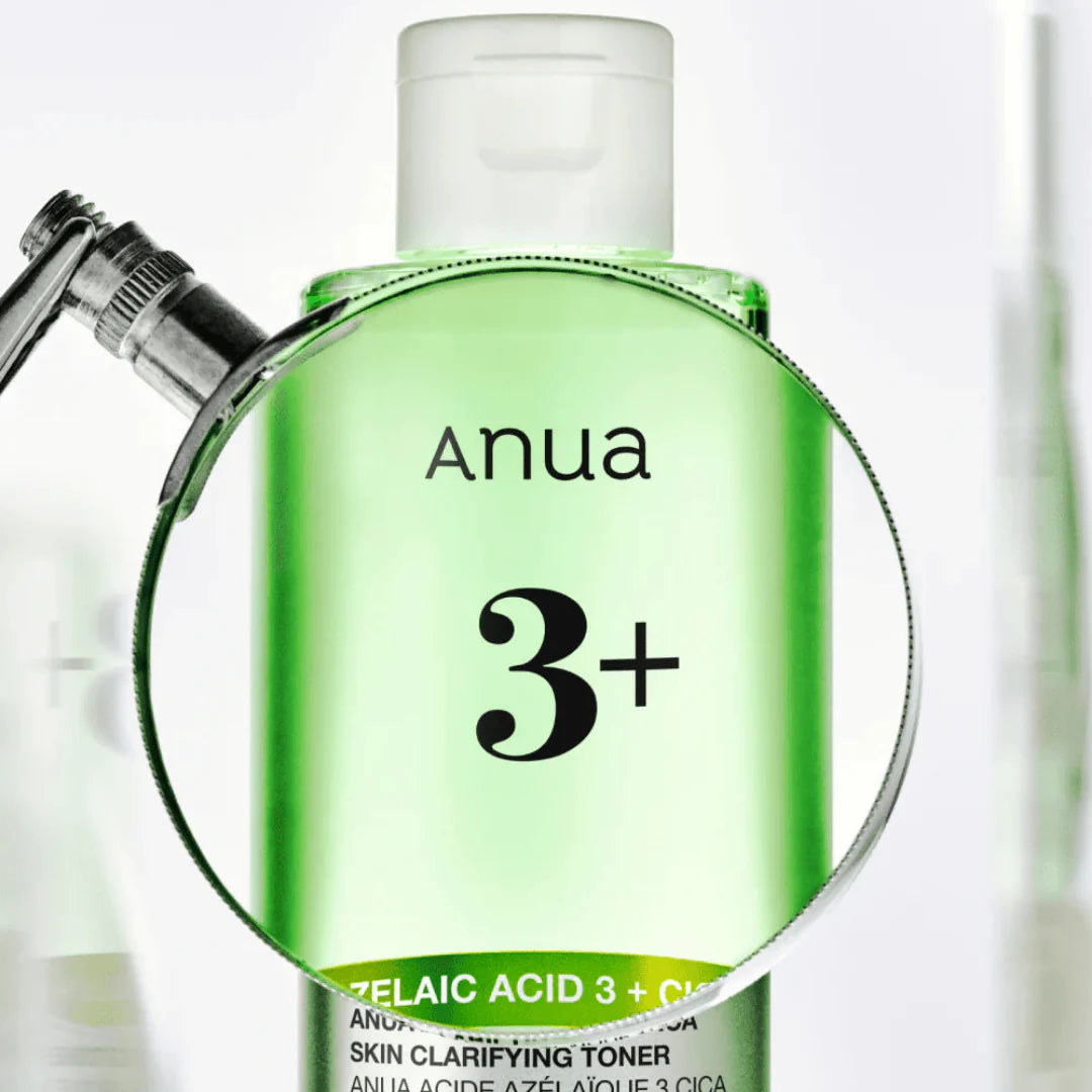 Green bottle of Anua skincare product with a pump on a white background