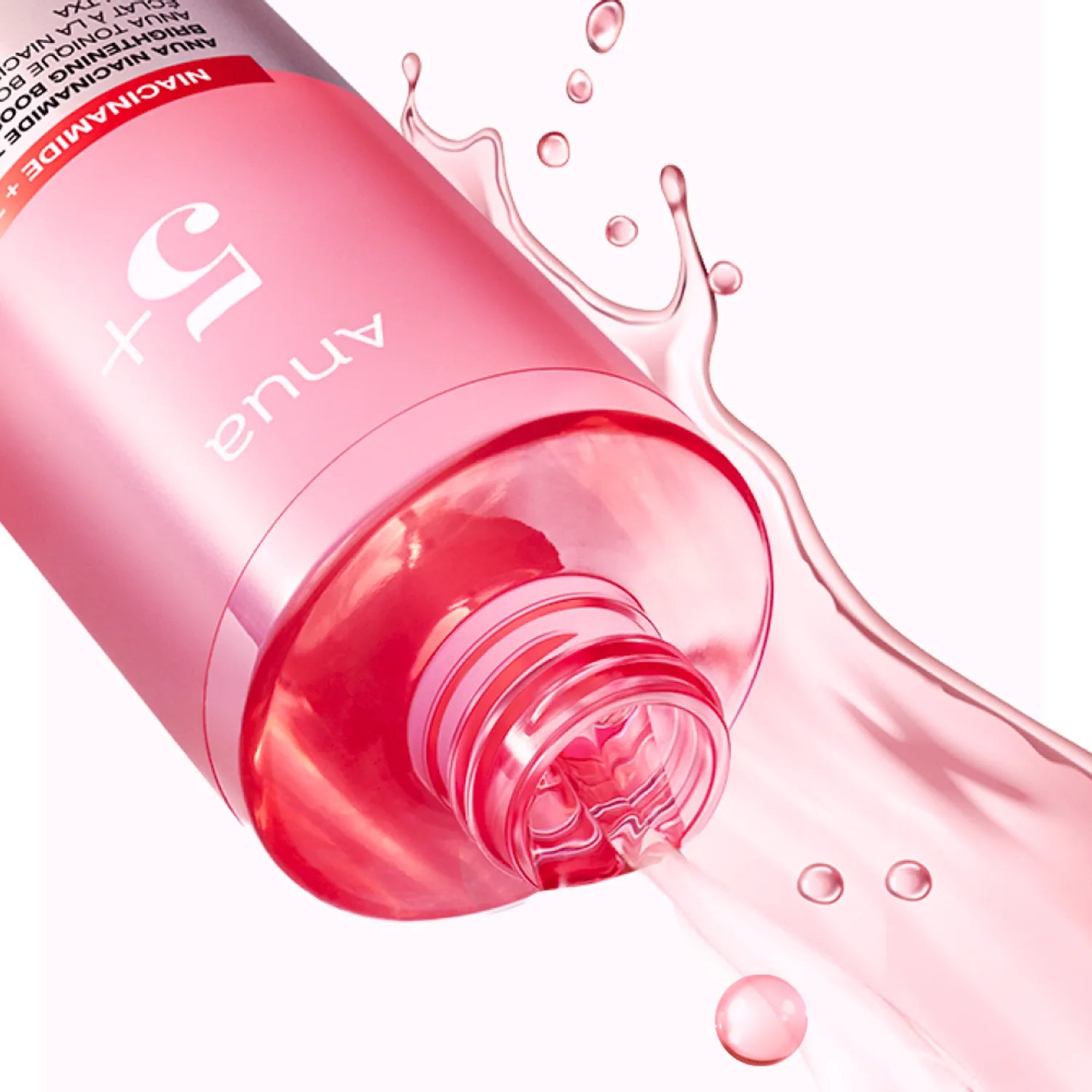 Pink bottle of Laneige skincare product with liquid spilling out on a white background