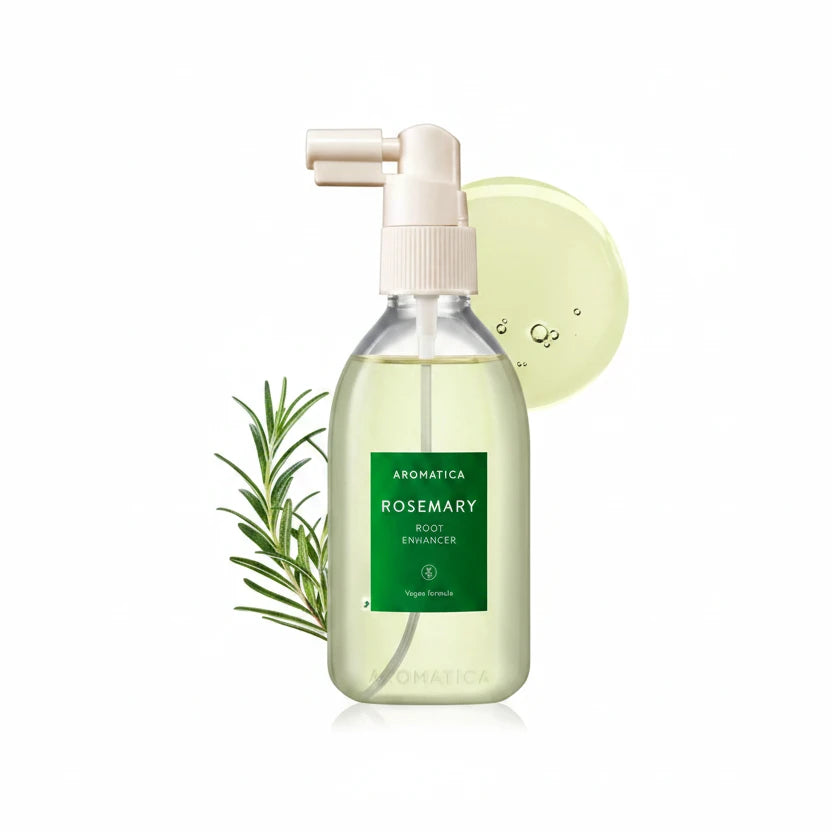 A bottle of AROMATICA Rosemary Root Enhancer spray with a green label, alongside a sprig of rosemary and a droplet of the product.