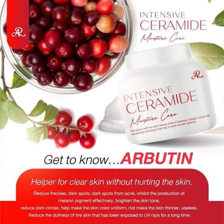 A cosmetic product labeled 'INTENSIVE CERAMIDE Moisture Care' shown alongside a glass bowl of red berries and leaves, with text promoting arbutin for clear skin.