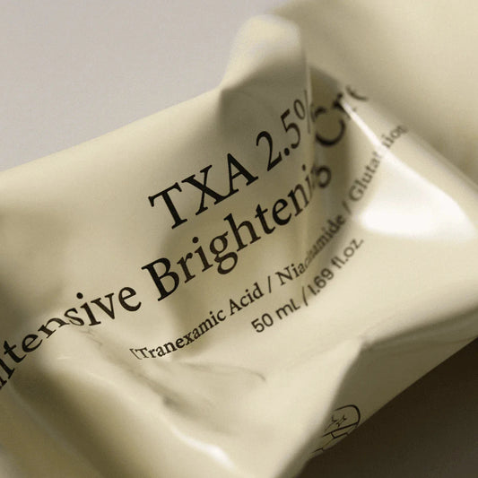 TXA 2.5% Intensive Brightening Cream packaging on a light background
