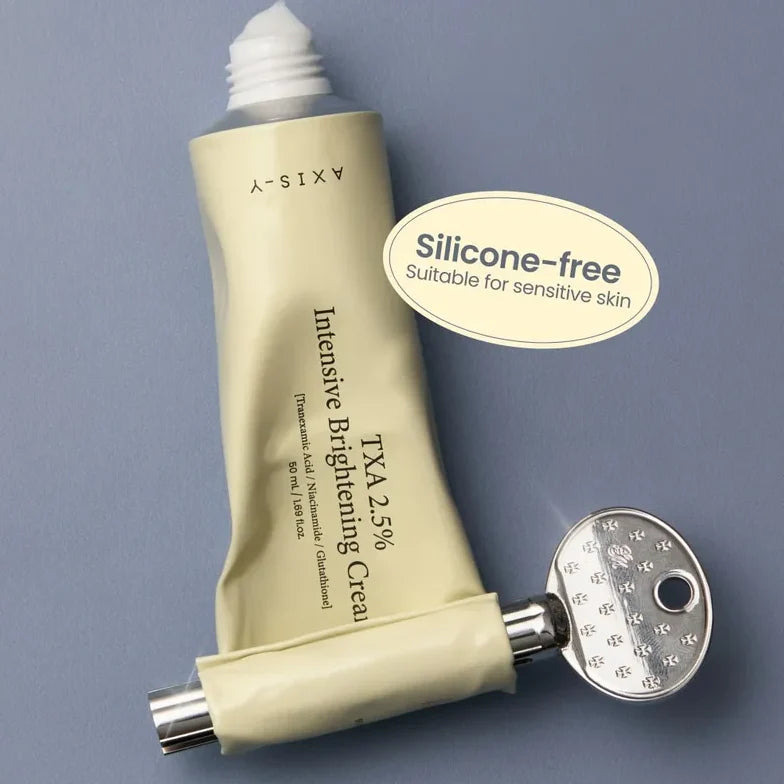 Tube of Intensive Brightening Cream with silicone-free label on a gray background