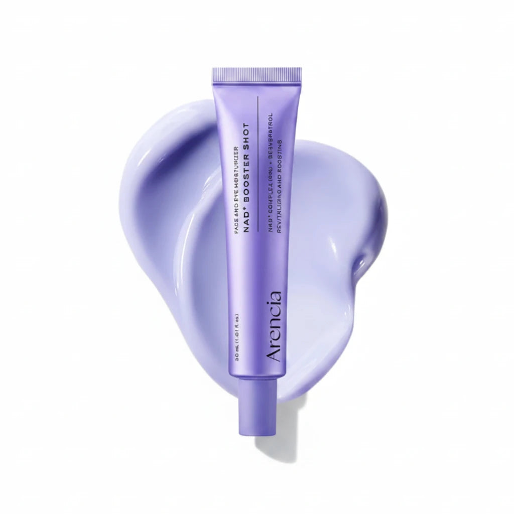 A lavender purple tube of Arencia NAD+ Booster Shot face and eye moisturizer, centered over a glossy, sculpted swirl of matching light purple cream on a white background.