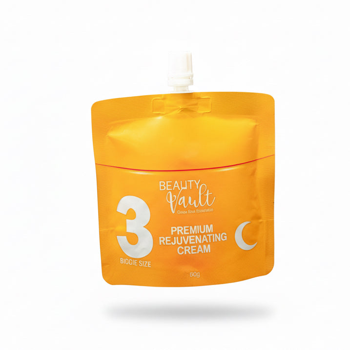Orange jar of Beauty Vault Premium Rejuvenating Cream on a glass surface with a blurred background