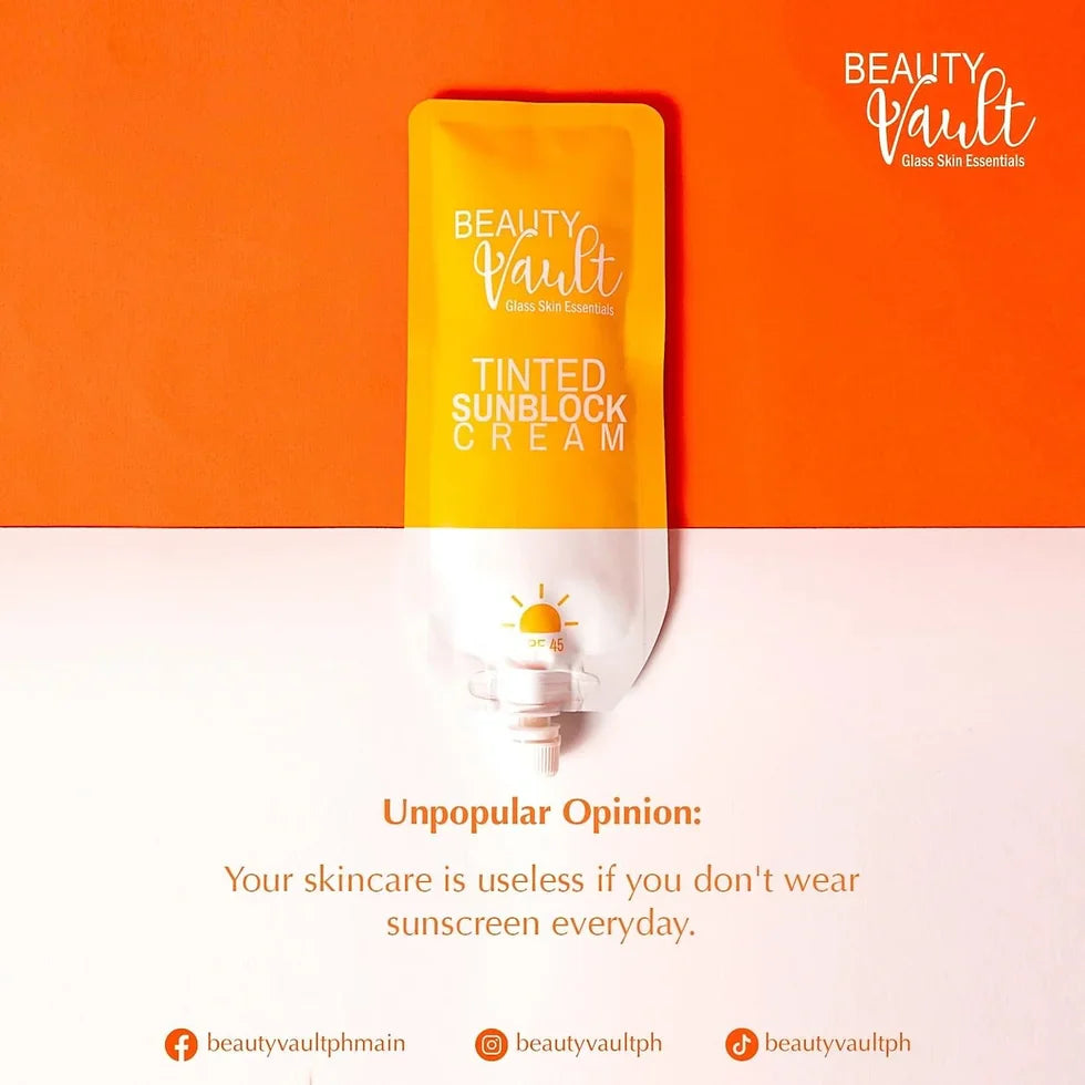 Tinted sunblock cream packaging with 'Beauty Vault' branding on an orange and white background.