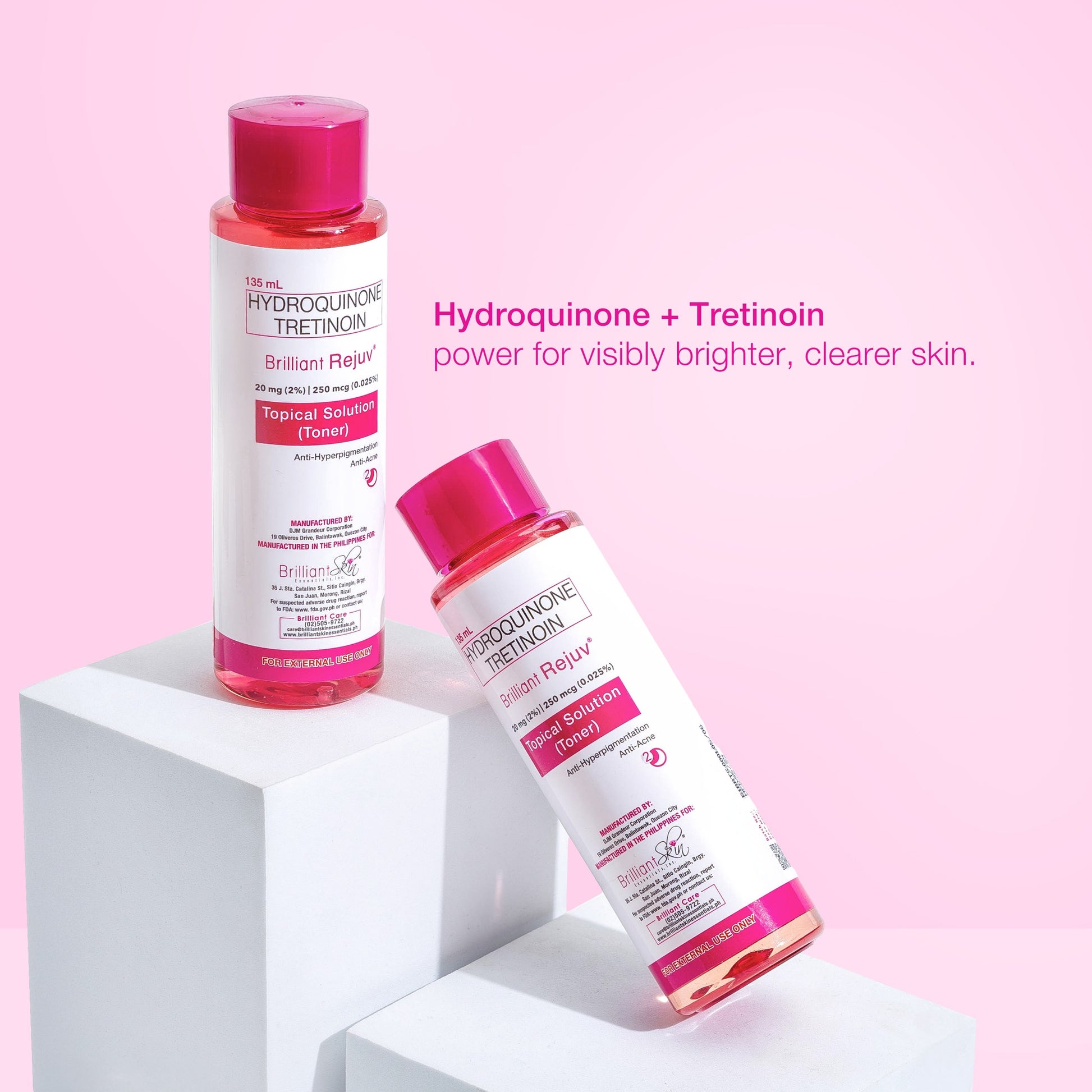 Two skincare products with pink caps on a white and pink background