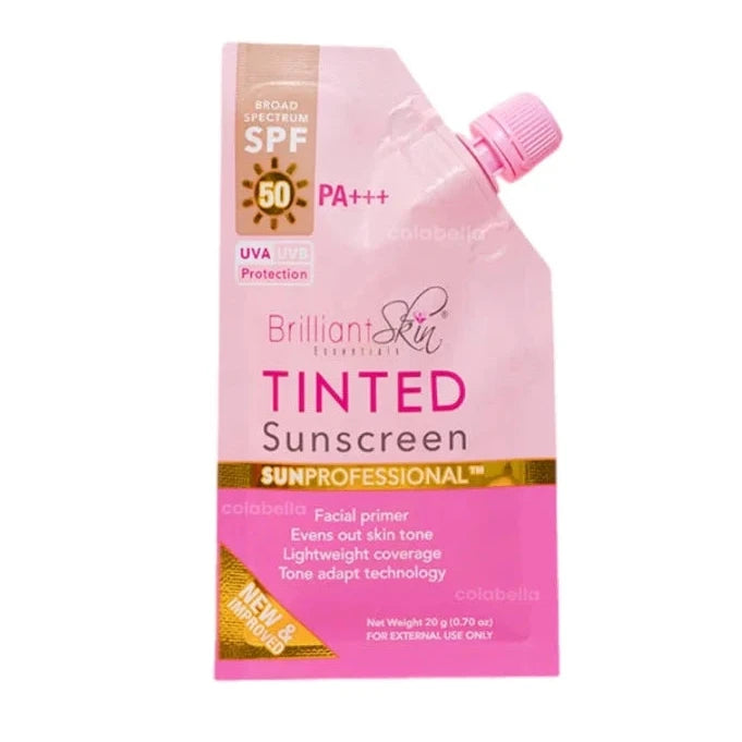 A sachet of Brilliant Skin Tinted Sunscreen with SPF 30 protection. The packaging is primarily pink with product information and branding printed on it.