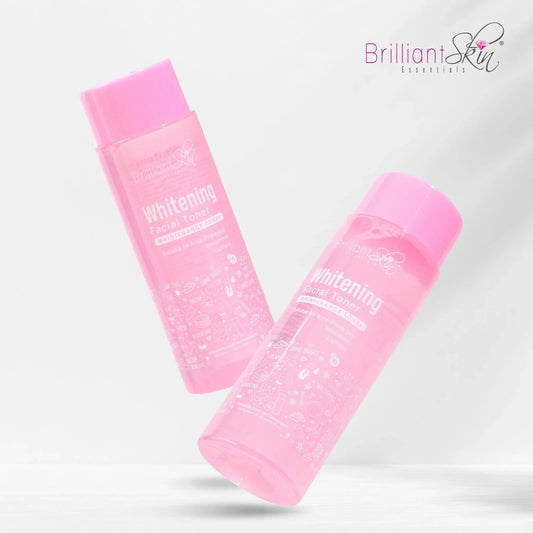 Two pink whitening face wash bottles on a light gray background with 'Brilliant Skin' branding.