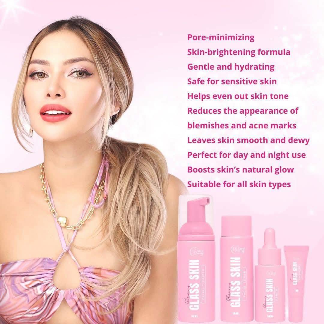 Woman with blonde hair and pink makeup, surrounded by Gloss Skin product bottles on a pink background.