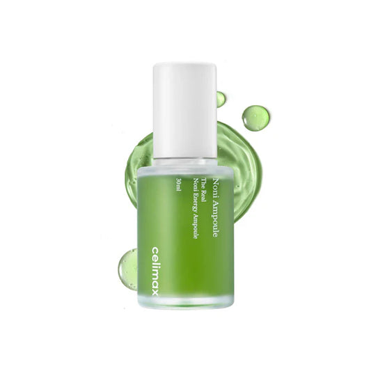 A bottle of The Real Noni Energy Ampoule by Celimax, with a green label and white cap, against a white background with green decorative elements.