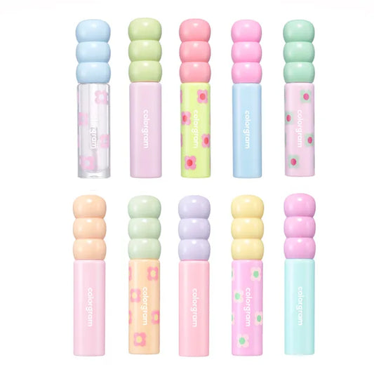 A collection of lip glosses in various colors, each with a glossy, radiant finish.