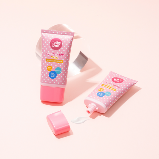 Two pink tubes of Cathy Doll skincare product on a light pink background