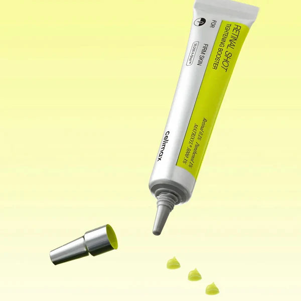 Cosmetic tube with applicator on a light yellow background