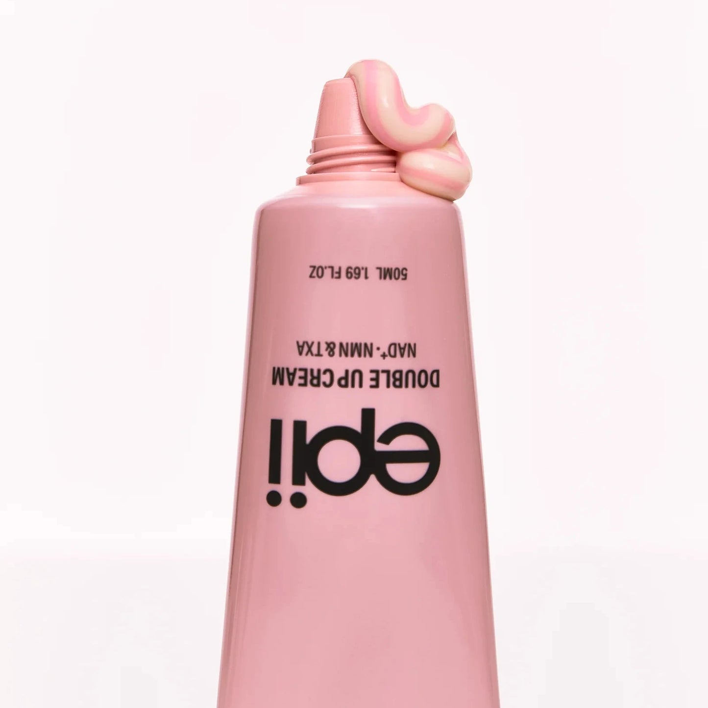Pink cosmetic bottle with black text on a white background