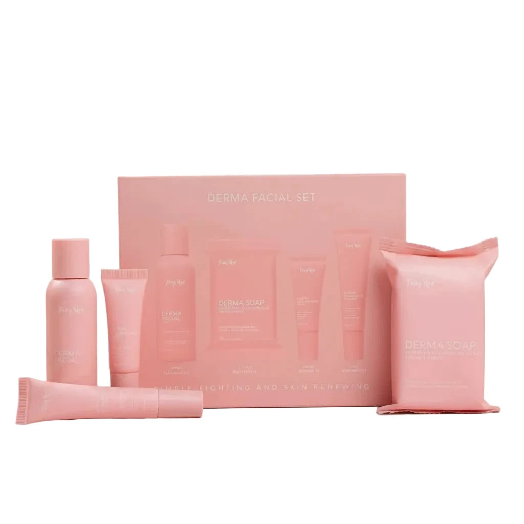 Pink skincare product set on a pink background