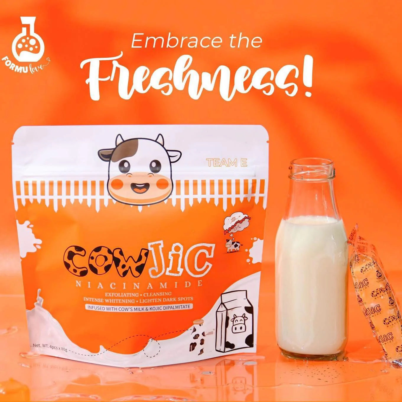CowJic product packaging with a bottle of milk on an orange background
