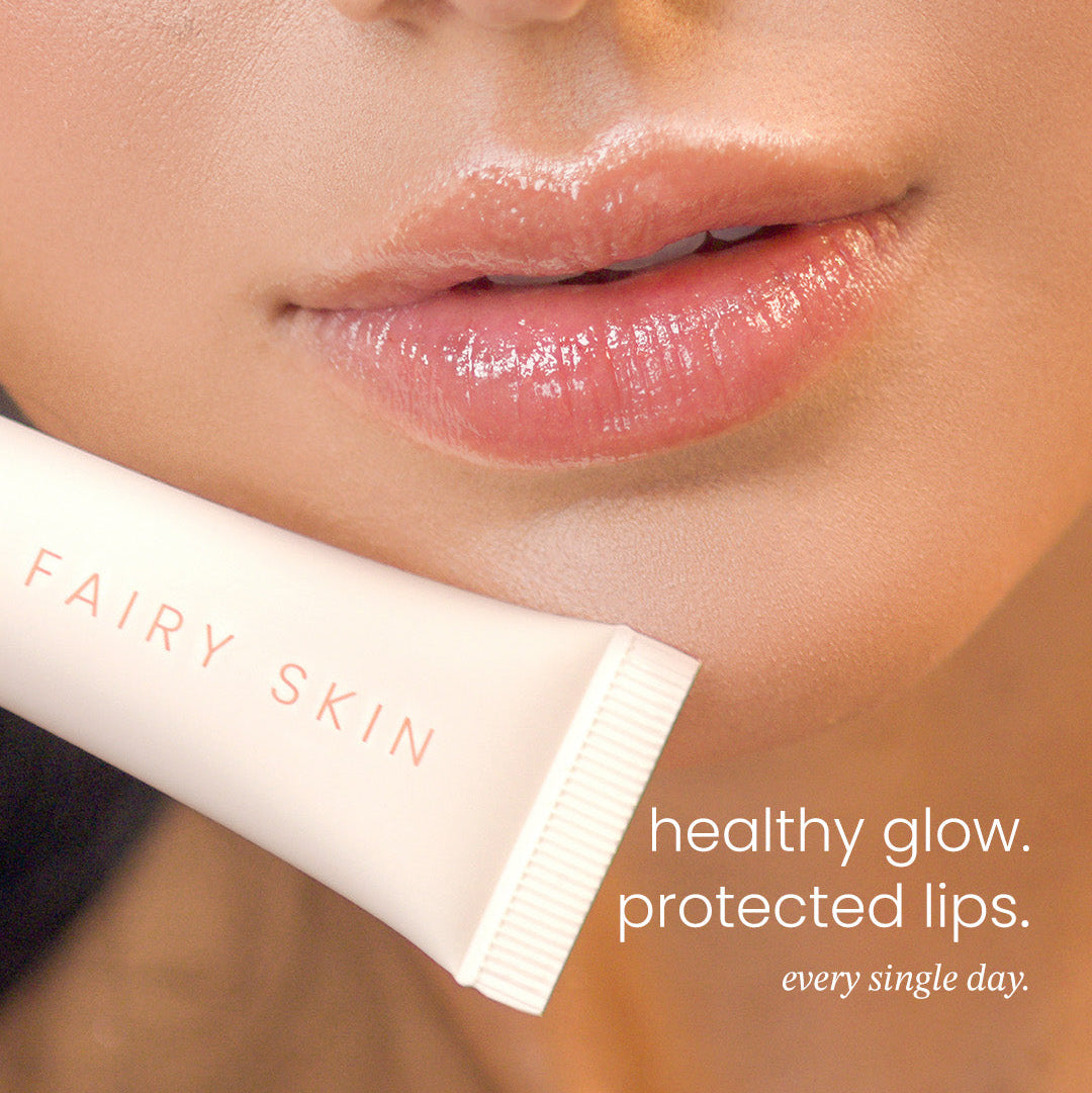 Lip balm tube labeled 'Fairy Skin' with a close-up of lips and text about healthy glow and protected lips.