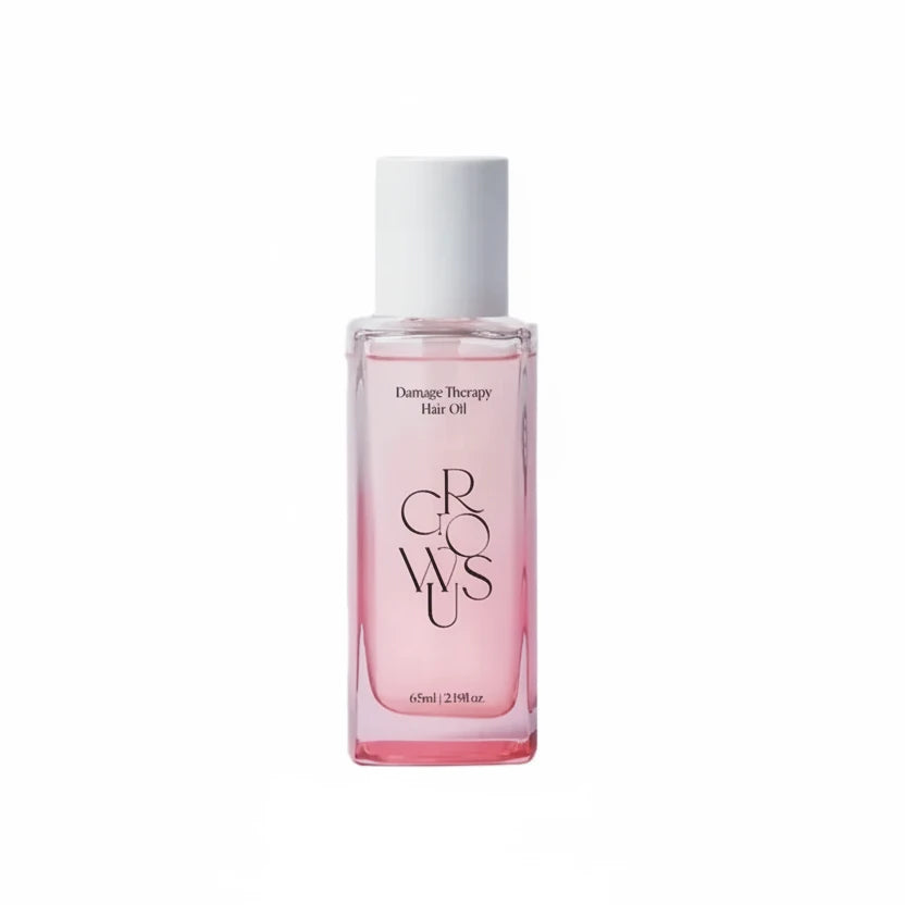 Pink bottle of hair oil with white cap on a light gray background