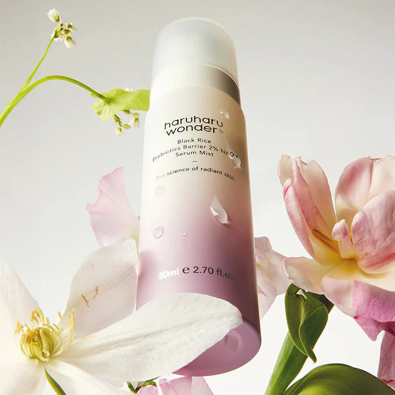 Haruharu Wonder serum mist bottle with flowers on a light background