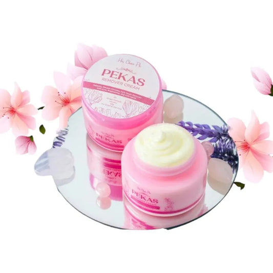 Two jars of Pekas cream on a round mirror with floral decorations.