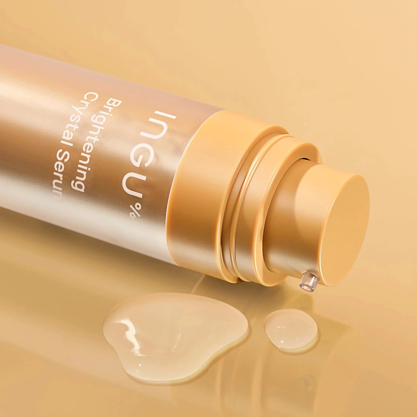 Cosmetic bottle with pump on a beige background