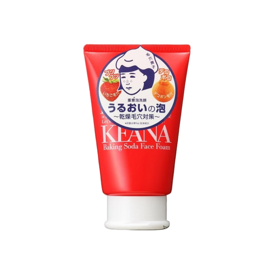 Red tube of KEANA Baking Soda Face Foam on a blurred bathroom counter background