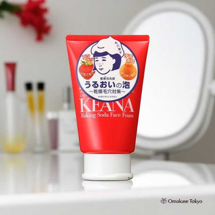 Red tube of KEANA Baking Soda Face Foam on a blurred bathroom counter background