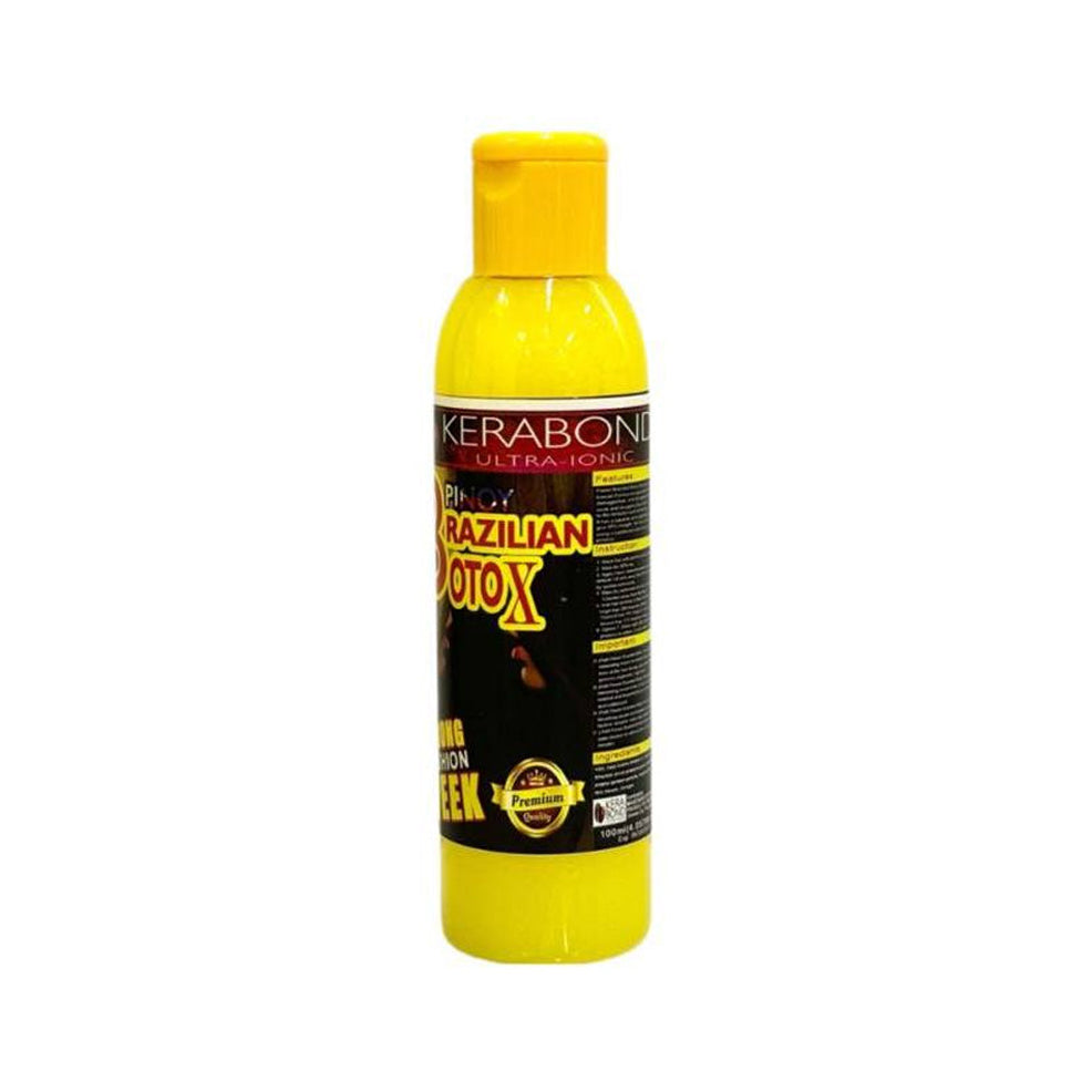 Yellow bottle of Kerabon Brazilian Motox hair product on a white background
