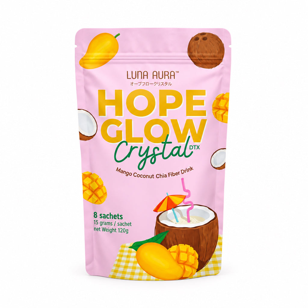 A stand-up pouch of Luna Aura Hope Glow Crystal drink mix, mango coconut flavor, shown on a white background with a pink 'New Product!' badge and the TeamskinCare logo above. The pouch is light pink with yellow and green text and fruit illustrations.