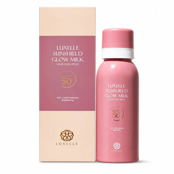 Pink sunscreen spray bottle and packaging with 'Luxelle' branding on a white background