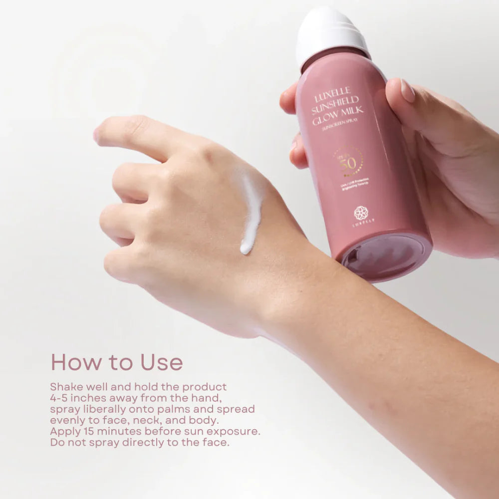 Person applying pink sunscreen spray to arm with text on how to use it.